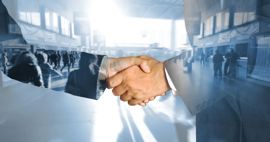 Shaking hands representing parterning with The Nu-Age Group as your managed services provider.
