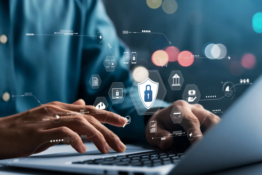 Person sitting at a laptop with graphical overlay representing how AI enhances cybersecurity and compliance