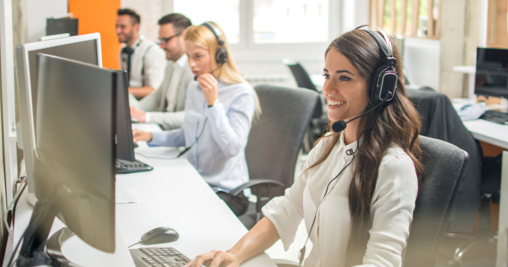 image of a call center and employees at their desk