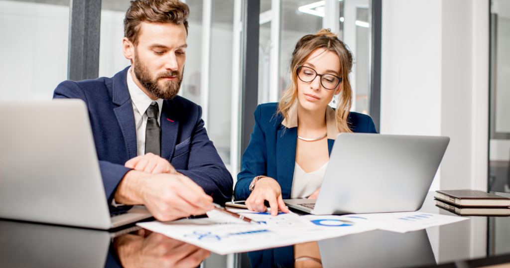 Business professionals analyzing streamlined operations data enabled by managed services solutions