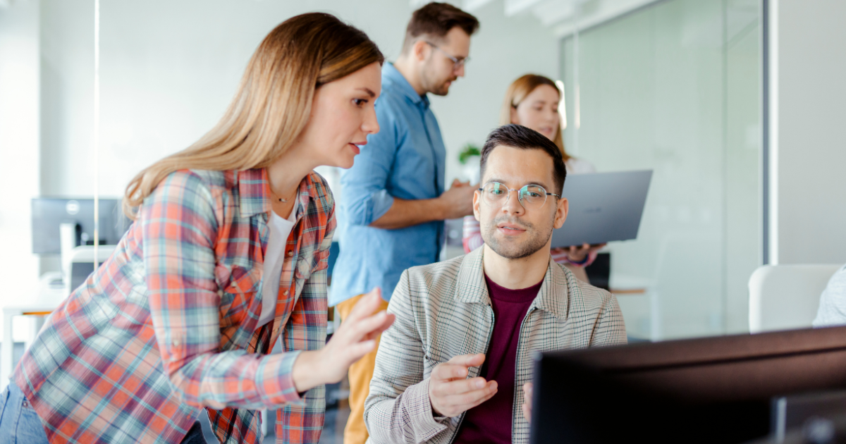 Team of professionals collaborating on cybersecurity regulations compliance