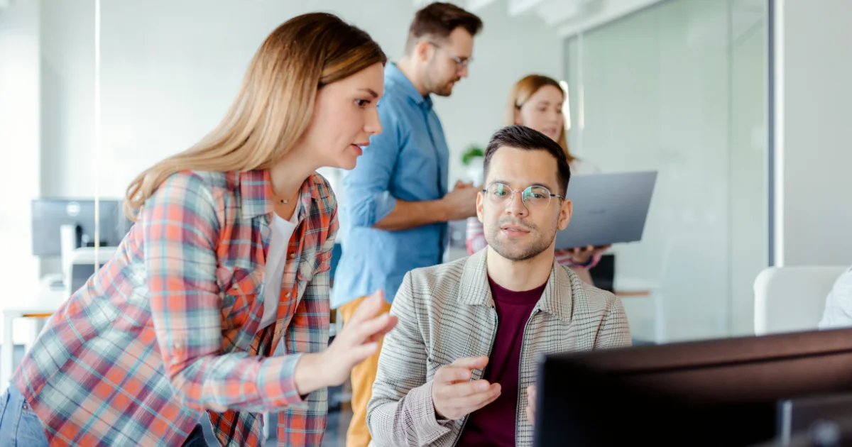 Team of professionals collaborating on cybersecurity regulations compliance
